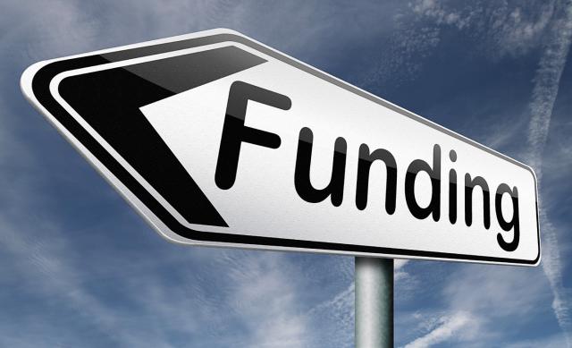 Funding sign with blue sky