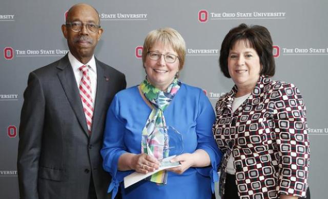 President Drake, Jean Scott (posing with award), Susan Basso