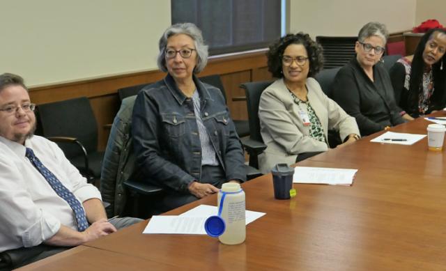 Members of President and Provost's Council on Women seated along meeting table