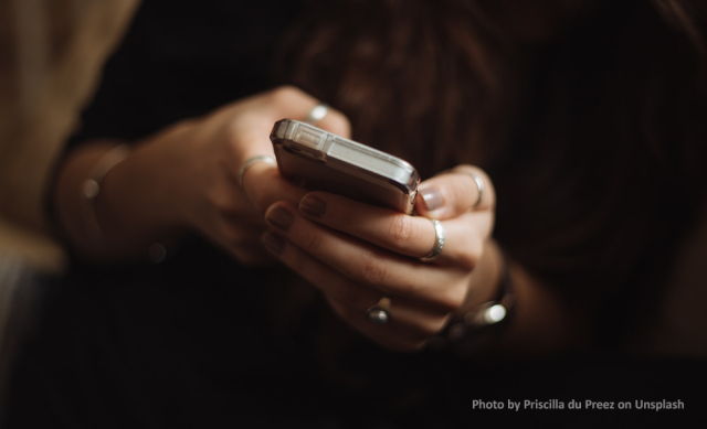 Woman's hands texting