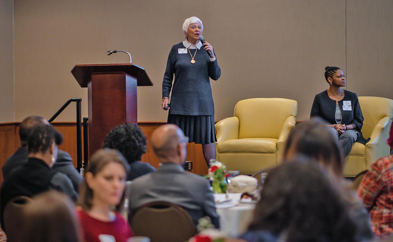 Dr. Holbrook speaking to luncheon attendees