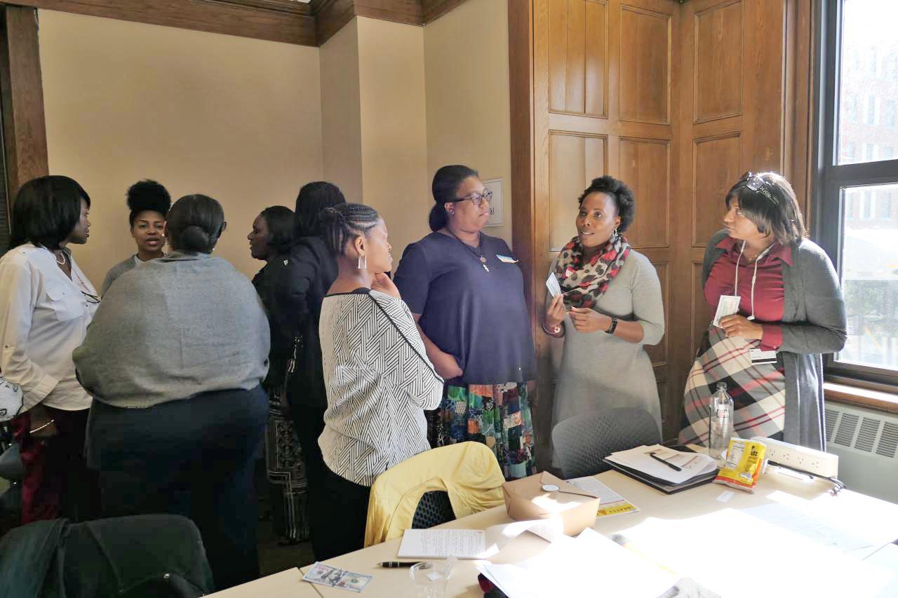 women gathered around a meeting room
