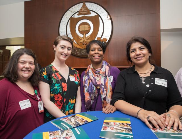 Four women around table