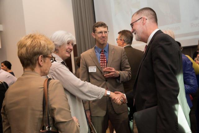 Provost McPherson shaking hands at 2018 reception