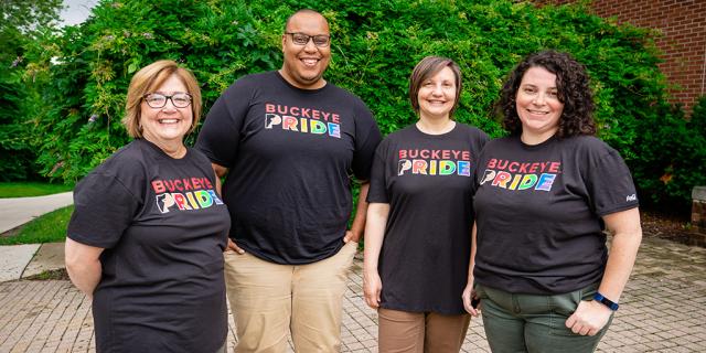 The Women's Place staff wearing LGBTQ pride shirts