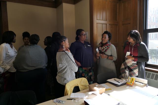 women gathered around a meeting room