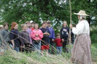 Photo of Gale Martin speaking to group at the historical society