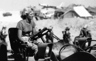 Nancy Ryan-Wenger driving military vehicle