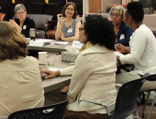 Women at table in conversation