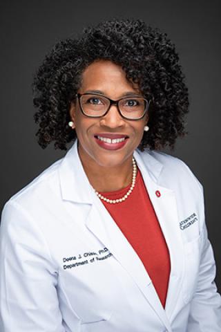 Portrait of Dr. Deena Chisolm in doctor's coat