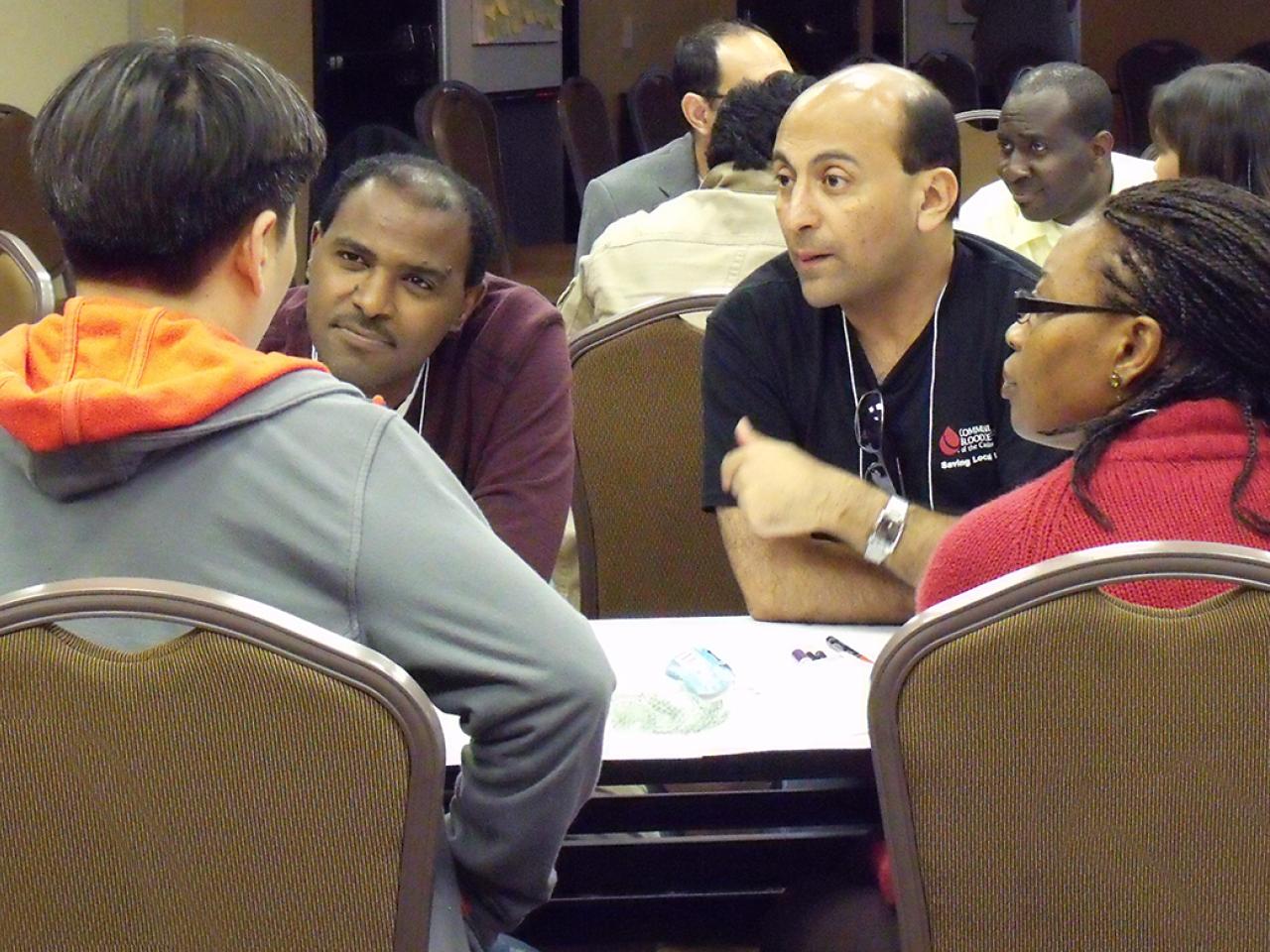 Diverse group of people in conversation
